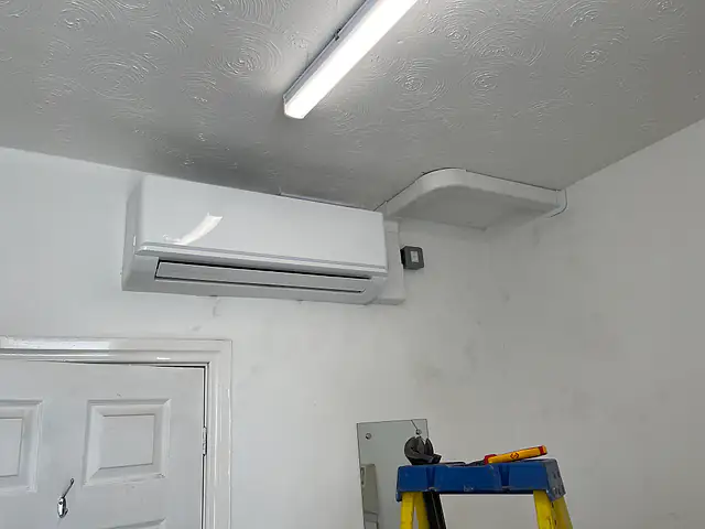 Air Conditioning Repairs in London Air Conditioning Repairs in London: a wall-mounted air conditioning unit during a service visit
